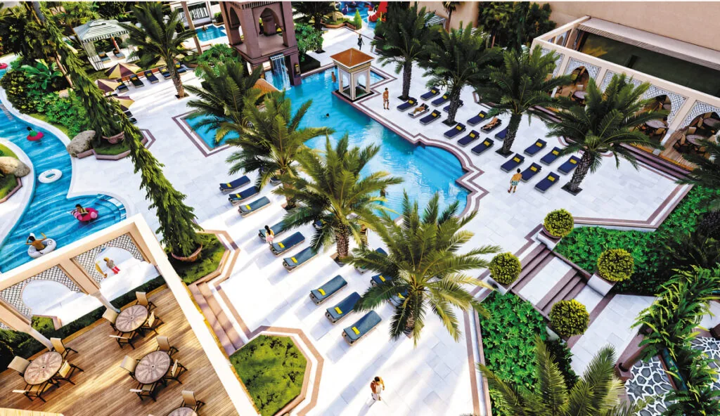 Anamore Resort swimming pool surrounded by greenery near Pushkar
